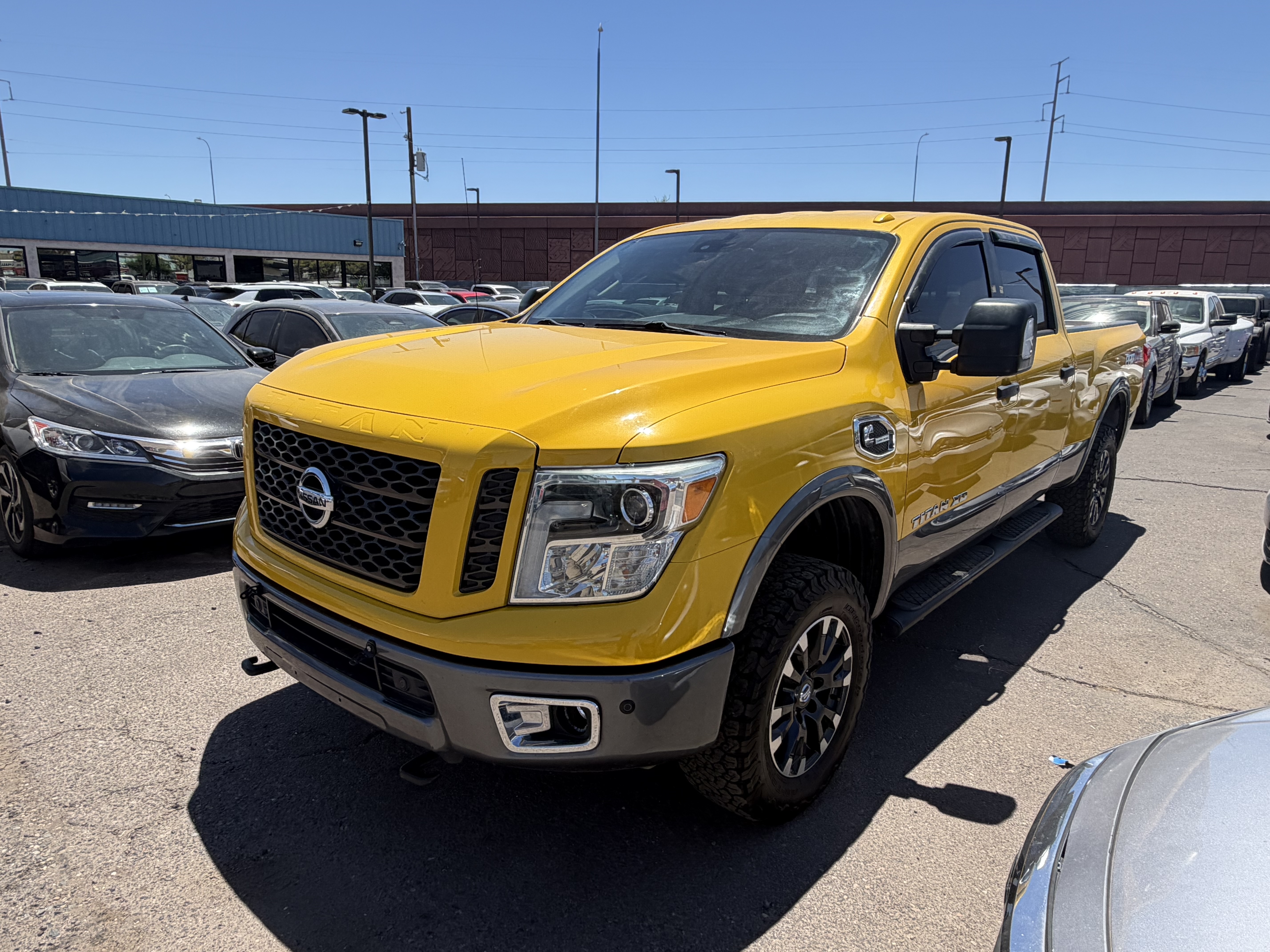 Yellow 2016 Nissan Titan XD PRO-4X Crew Cab 4WD Pickup Truck Four-Wheel Drive Automatic