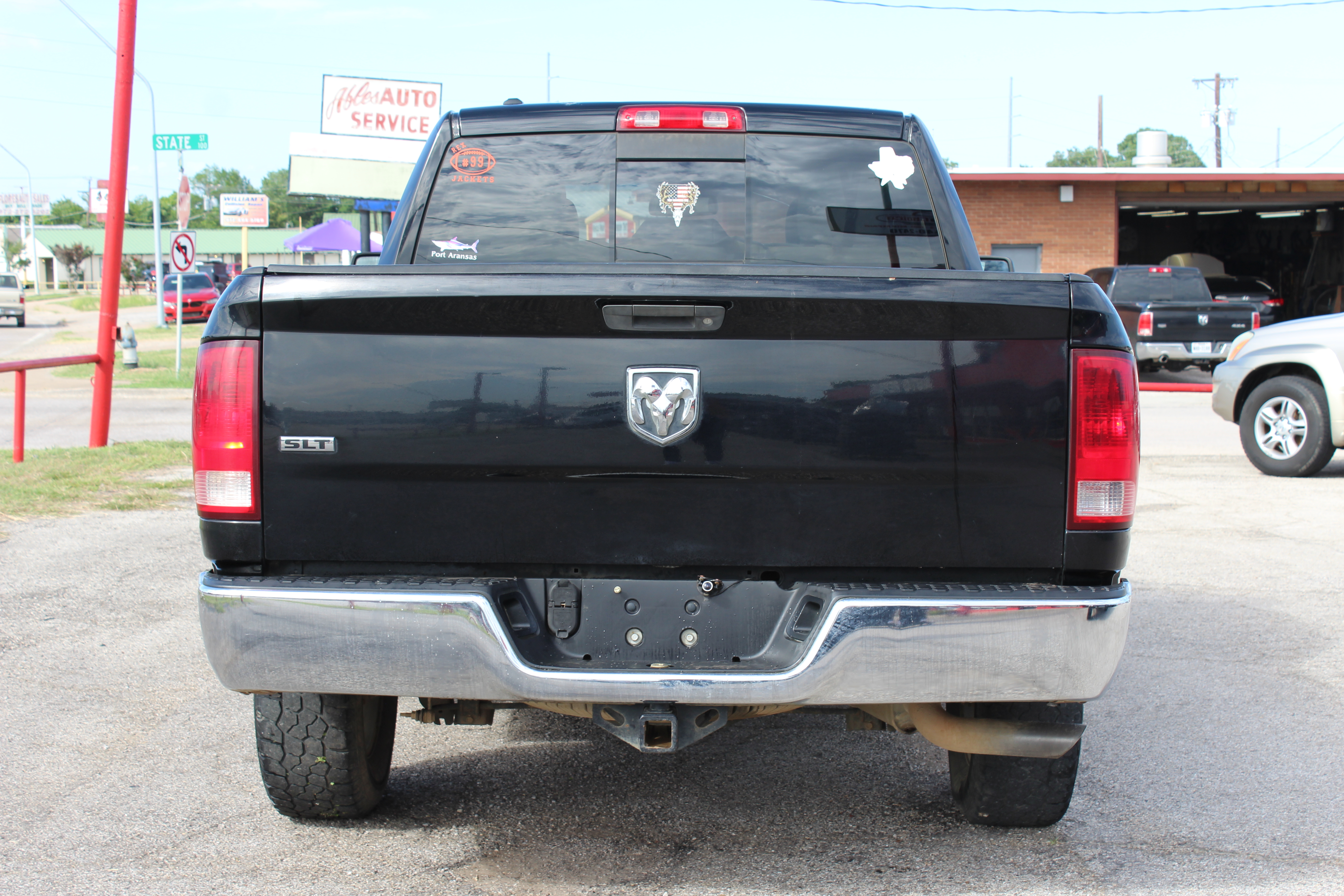 2014 RAM 1500 2WD Quad Cab 140.5 SLT - Black exterior view 10