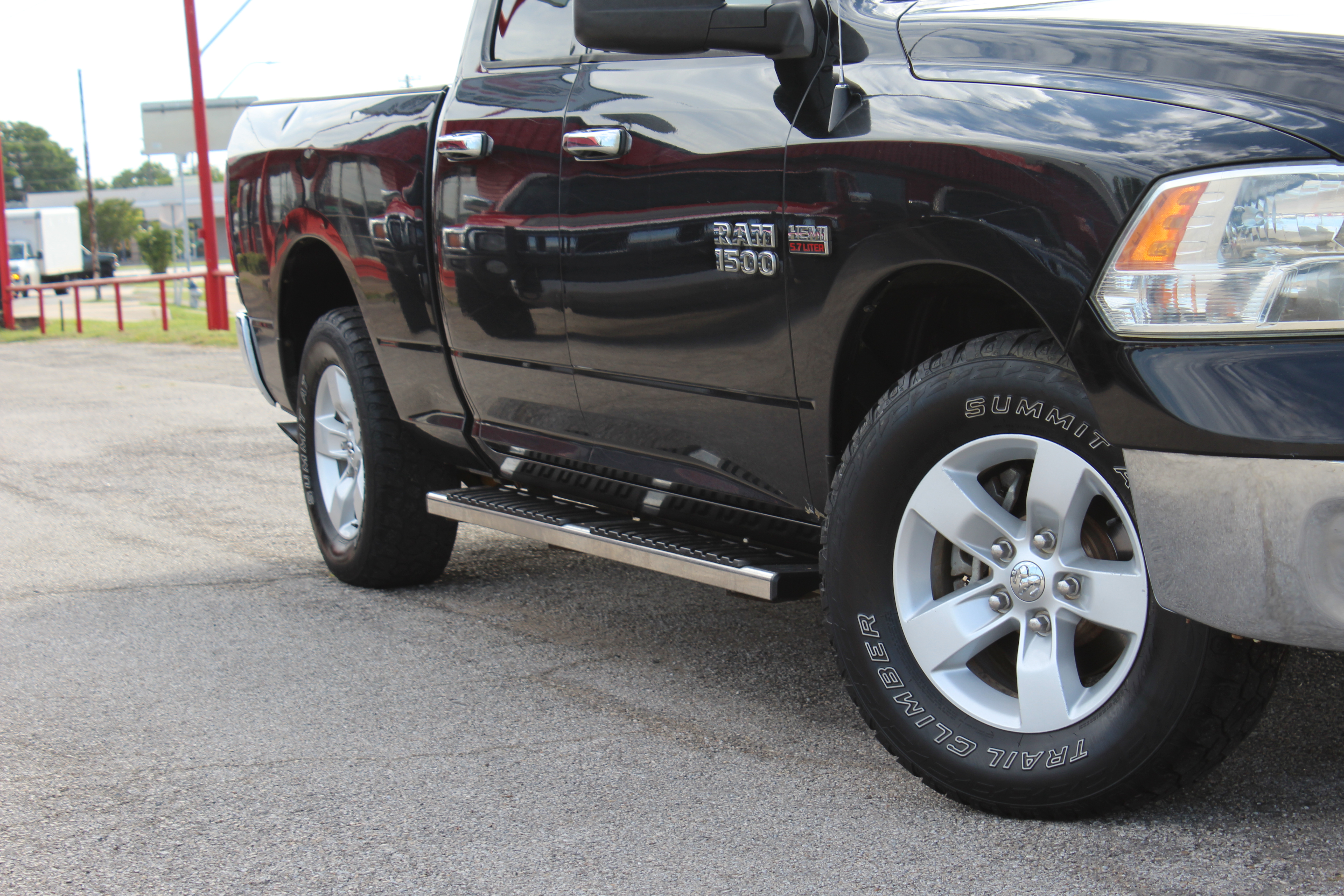 2014 RAM 1500 2WD Quad Cab 140.5 SLT - Black exterior view 2