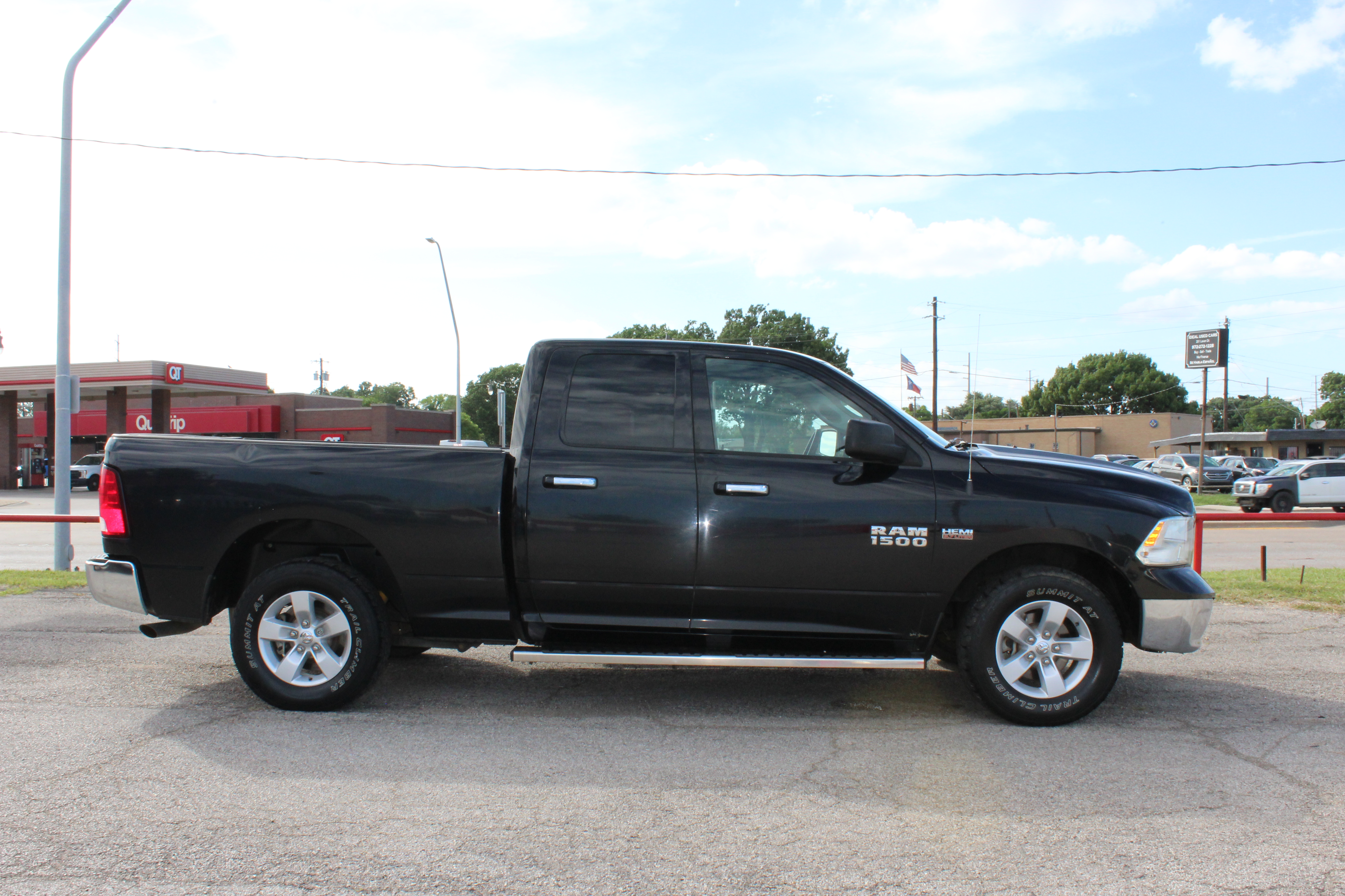 2014 RAM 1500 2WD Quad Cab 140.5 SLT - Black exterior view 13