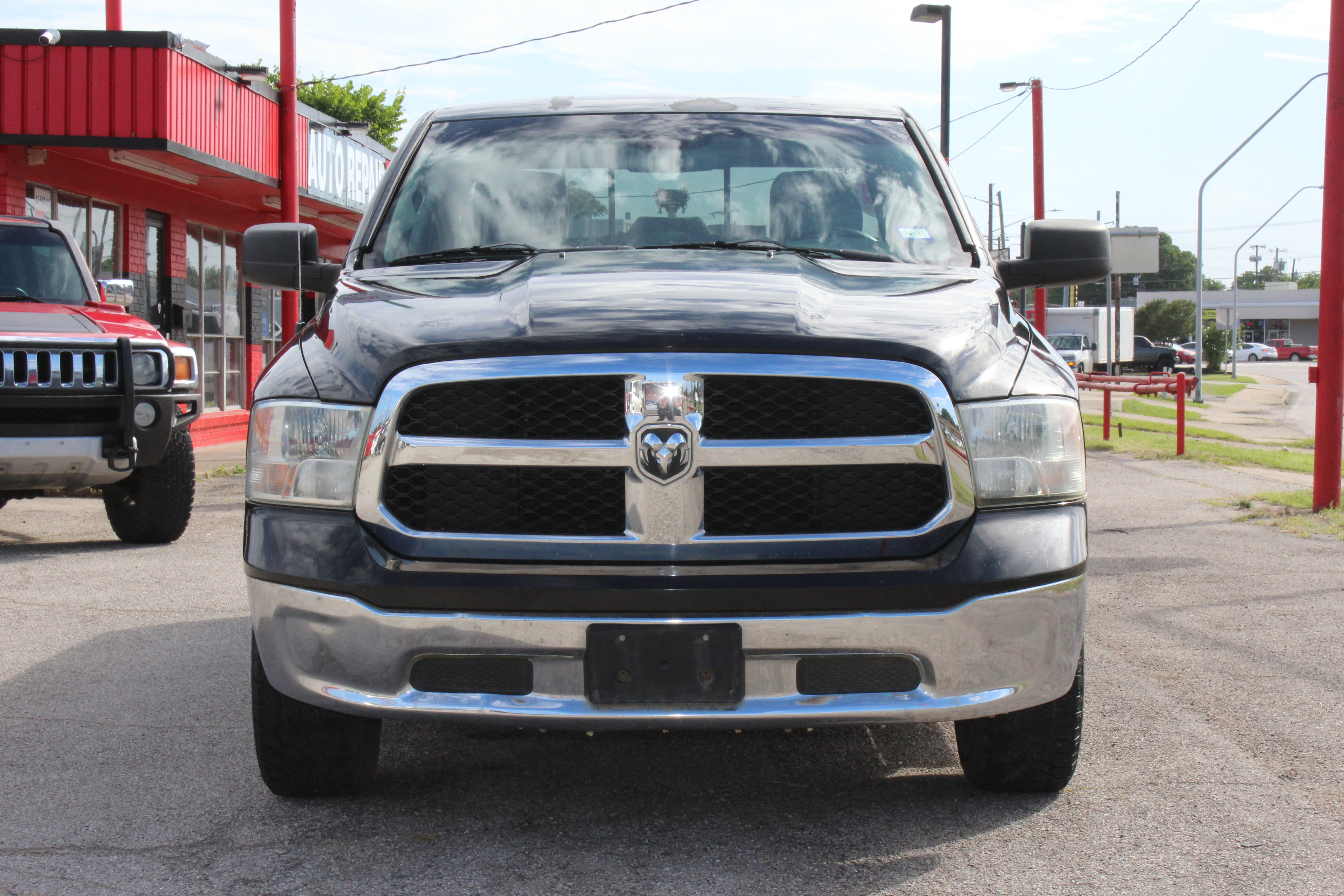 2014 RAM 1500 2WD Quad Cab 140.5 SLT - Black exterior view 4