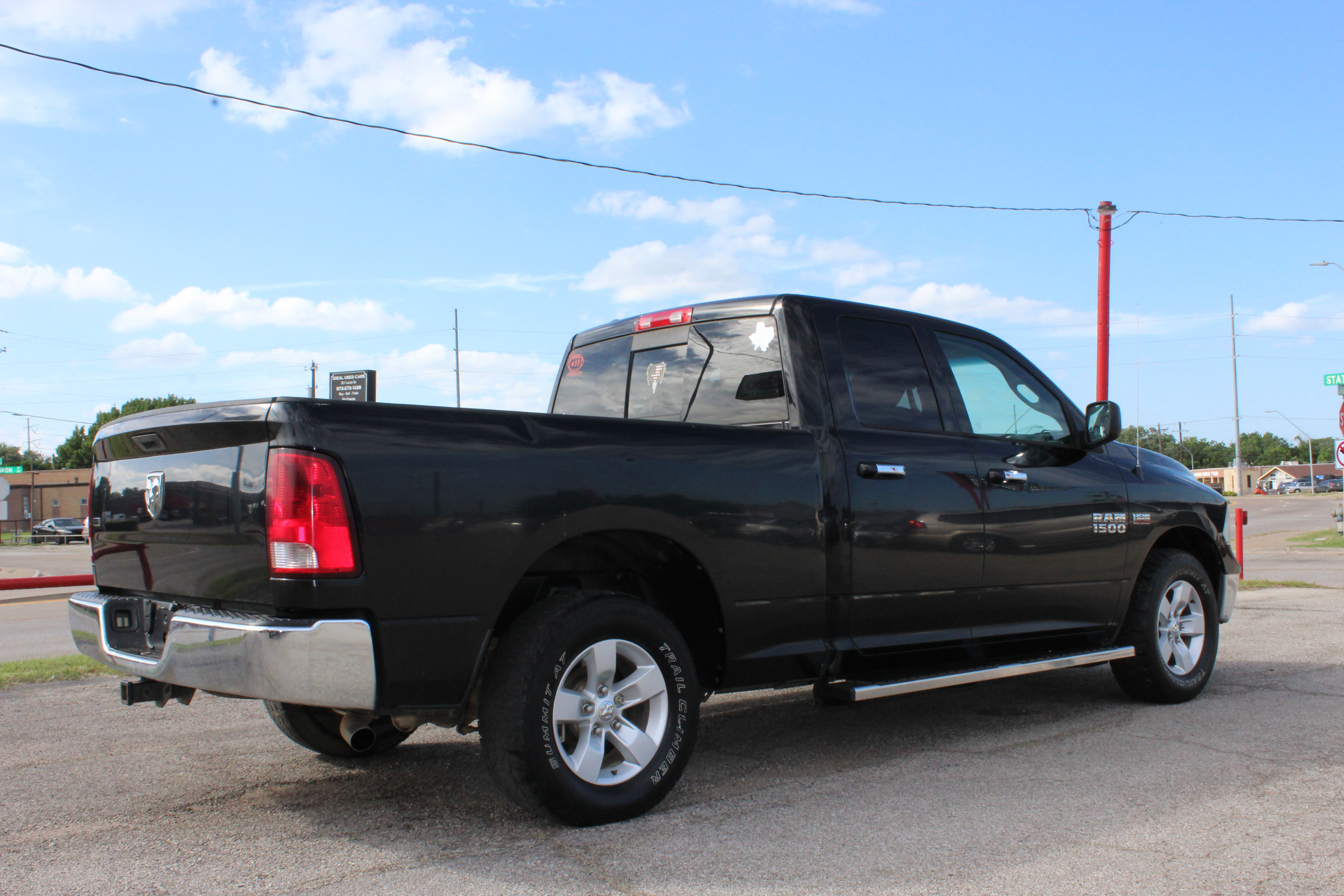 2014 RAM 1500 2WD Quad Cab 140.5 SLT - Black exterior view 12