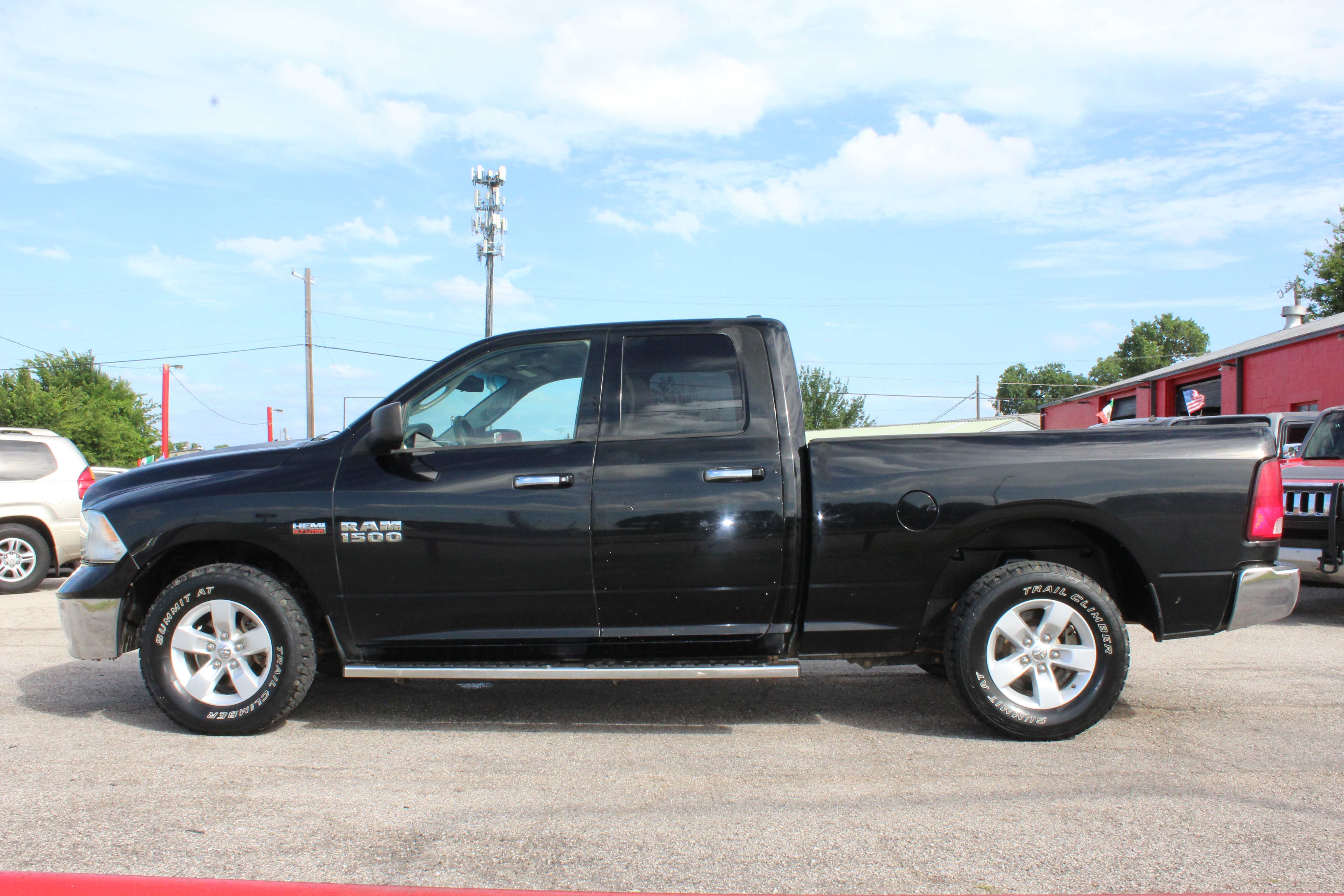 2014 RAM 1500 2WD Quad Cab 140.5 SLT - Black exterior view 7