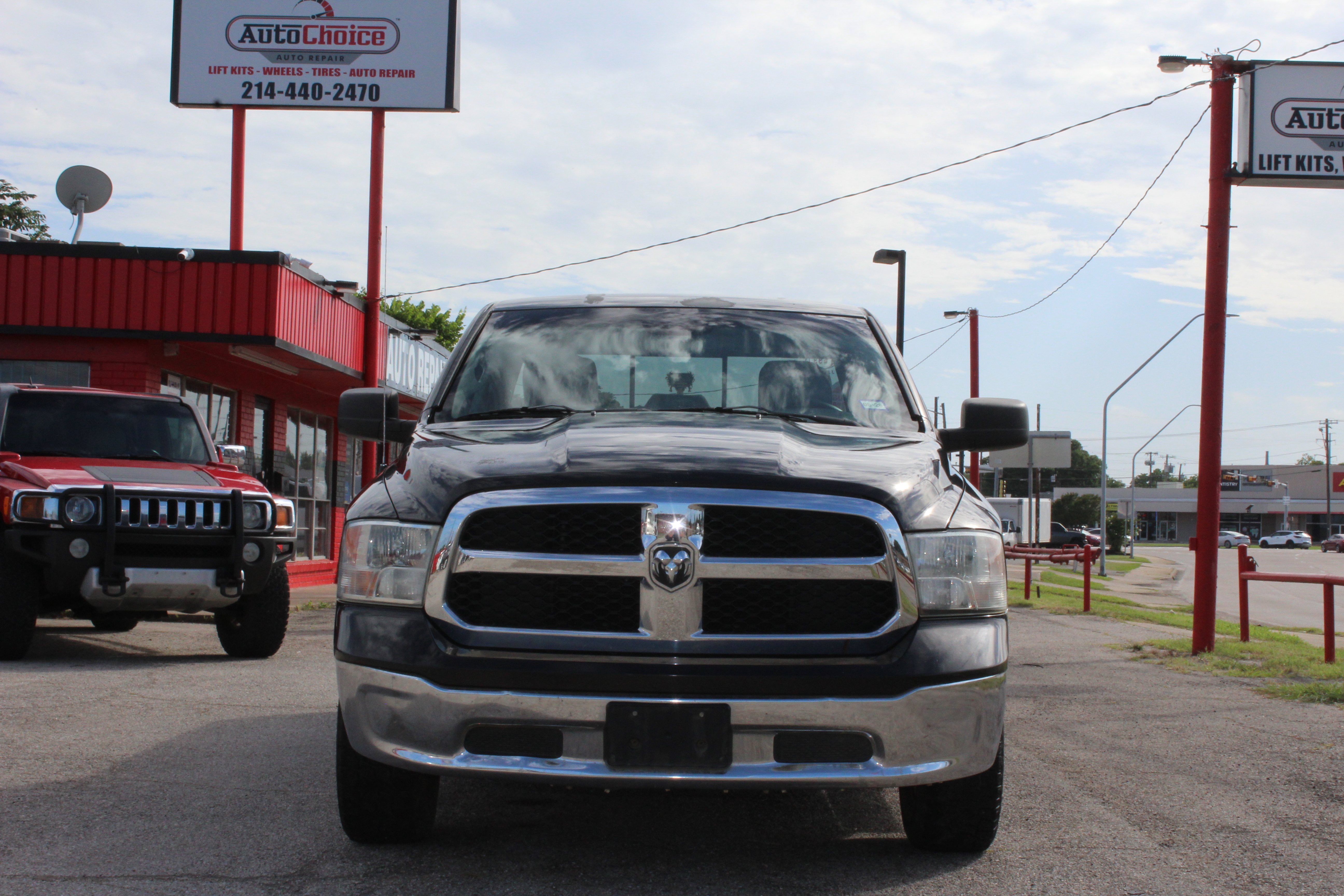 2014 RAM 1500 2WD Quad Cab 140.5 SLT - Black exterior view 3