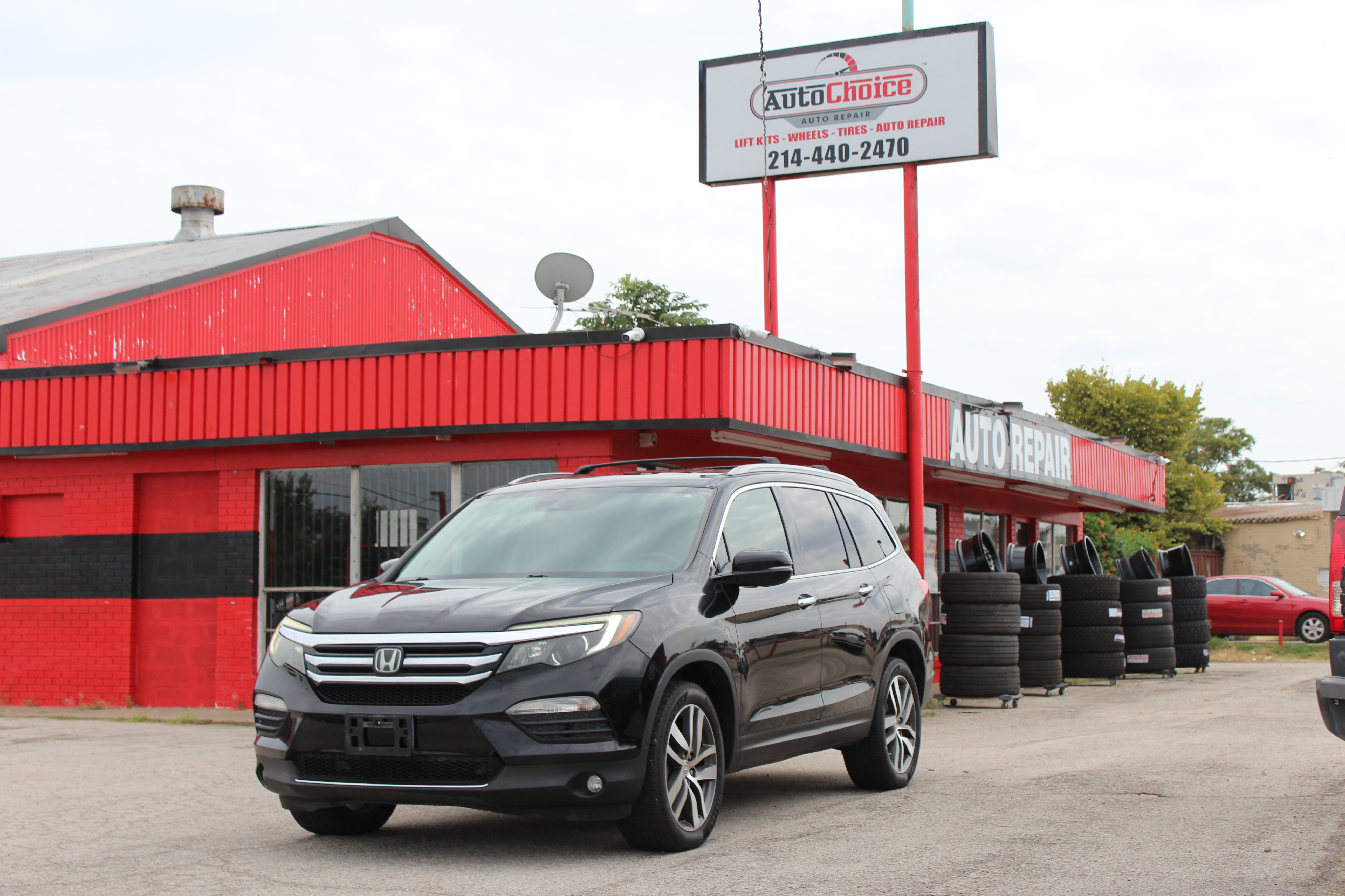 2016 Honda Pilot AWD 4dr Touring w/RES & Navi - Black exterior view 4