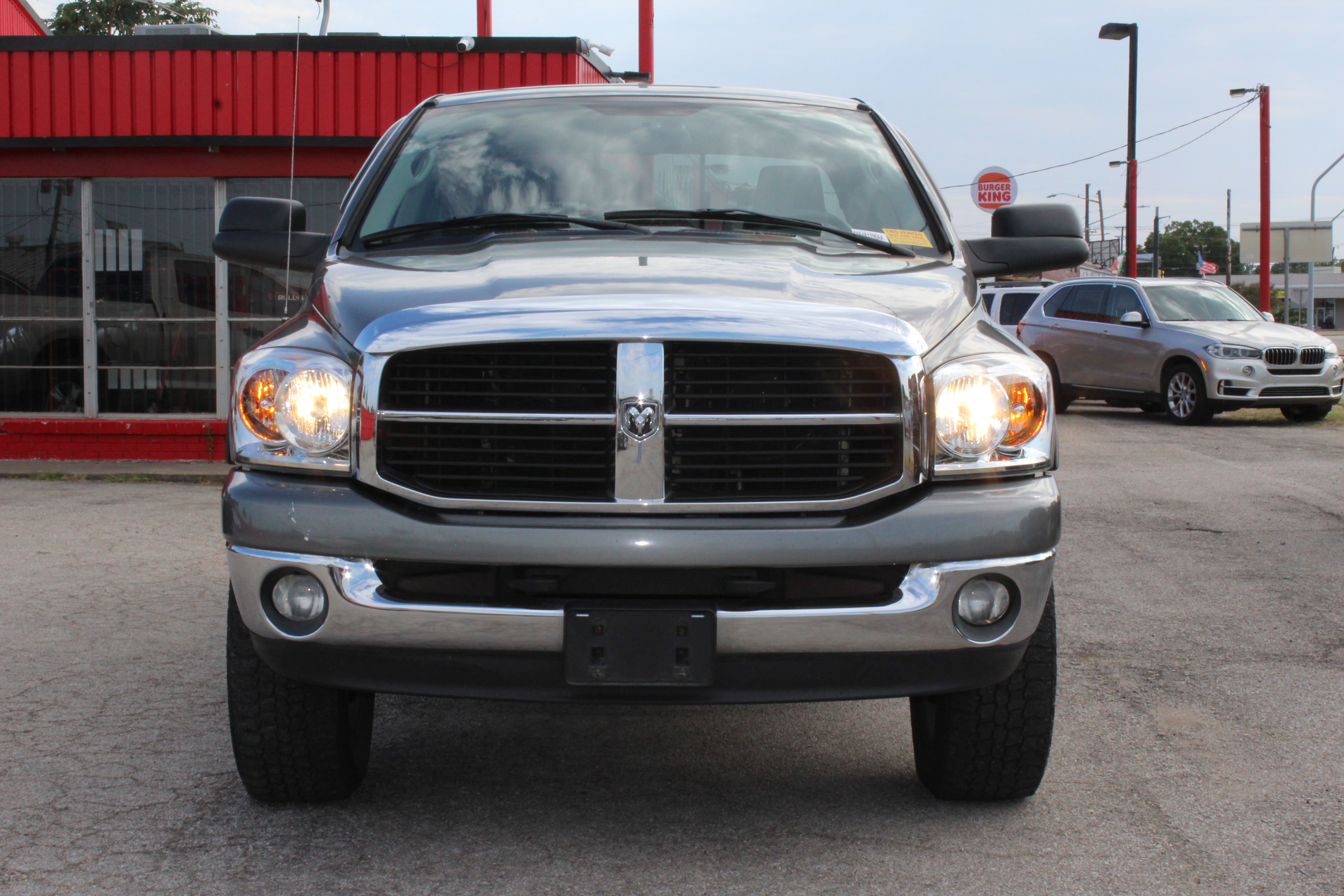 2006 Dodge Ram 1500 4dr Quad Cab 140.5 4WD SLT - Gold exterior view 4