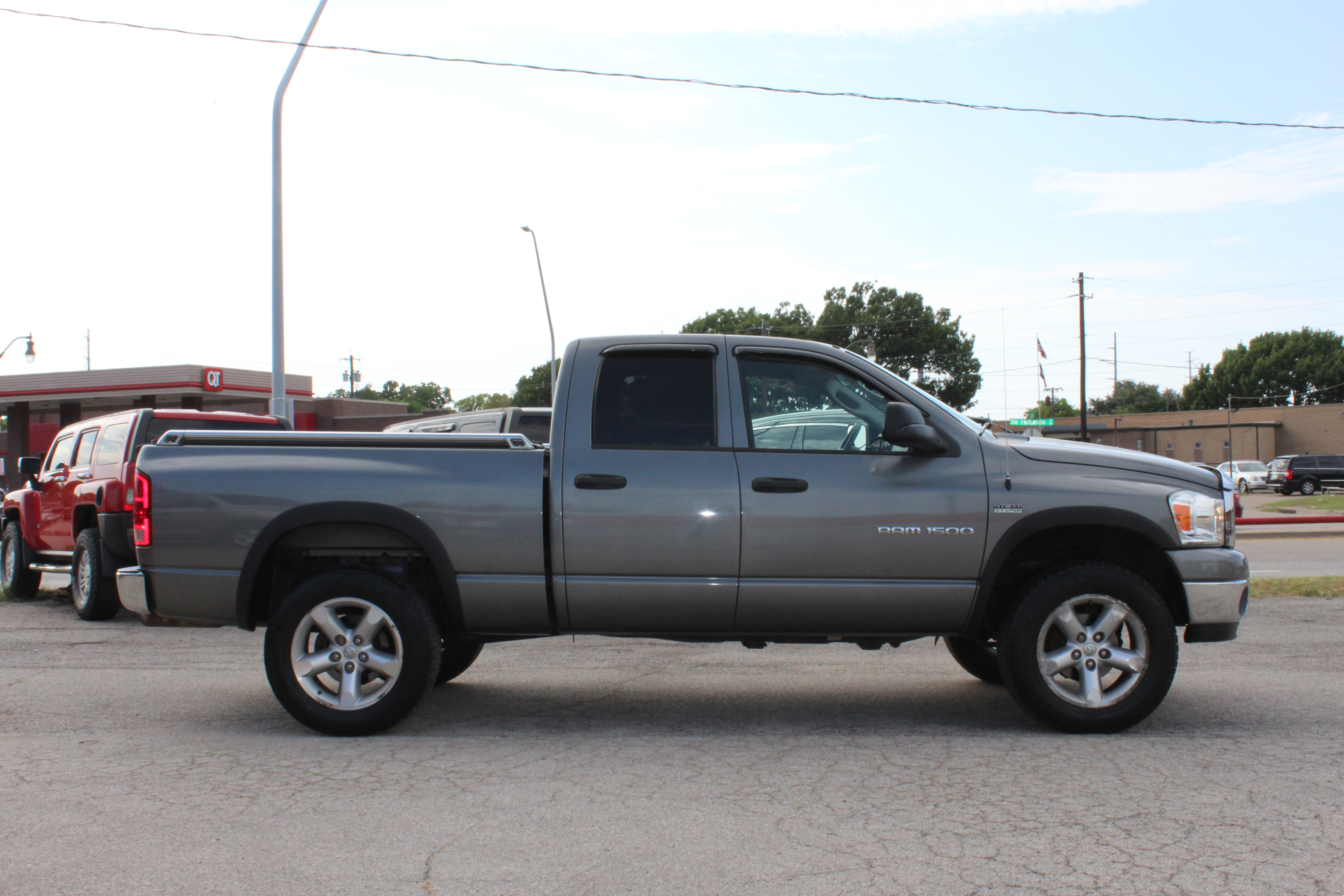 2006 Dodge Ram 1500 4dr Quad Cab 140.5 4WD SLT - Gold exterior view 10